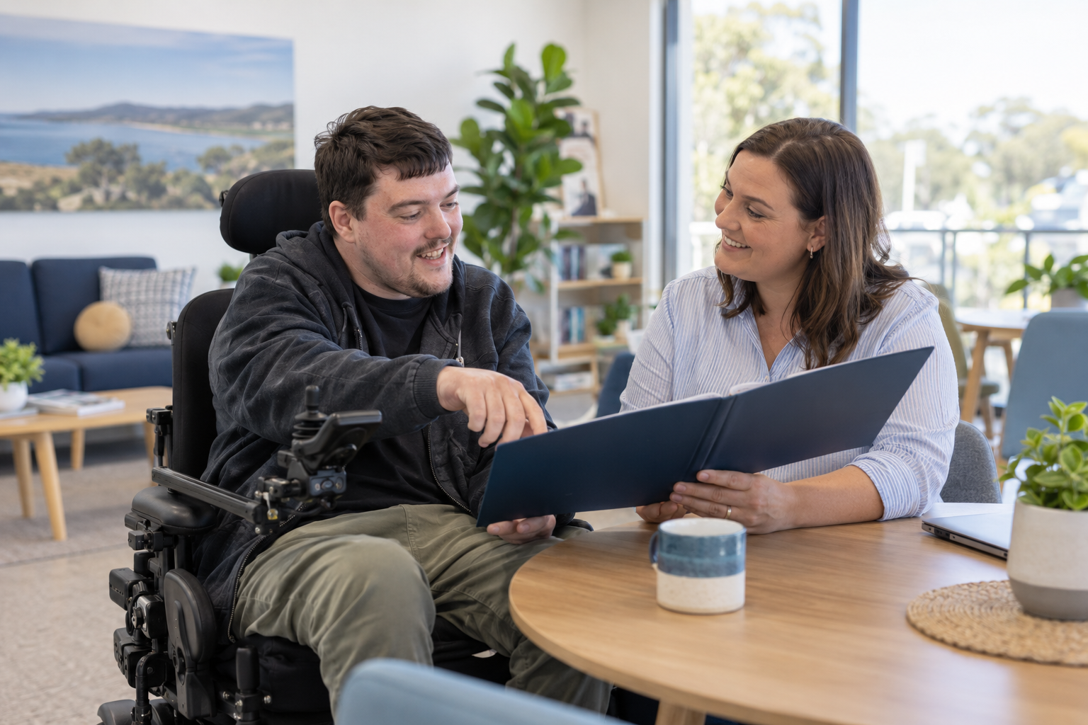 A participant and Support Coordinator reviewing an NDIS plan together